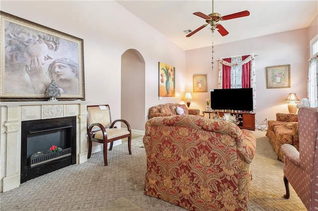 living room featuring ceiling fan, light colored carpet, and lofted ceiling