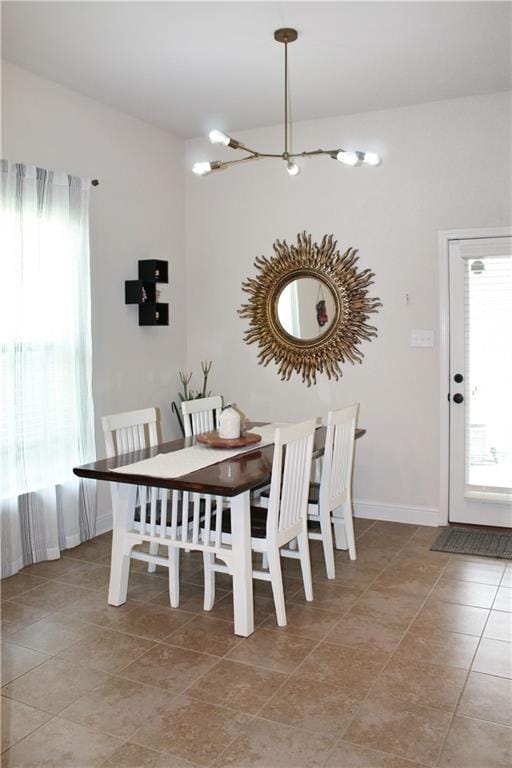 dining space with light tile patterned floors