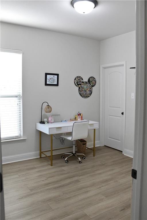 office with light hardwood / wood-style floors