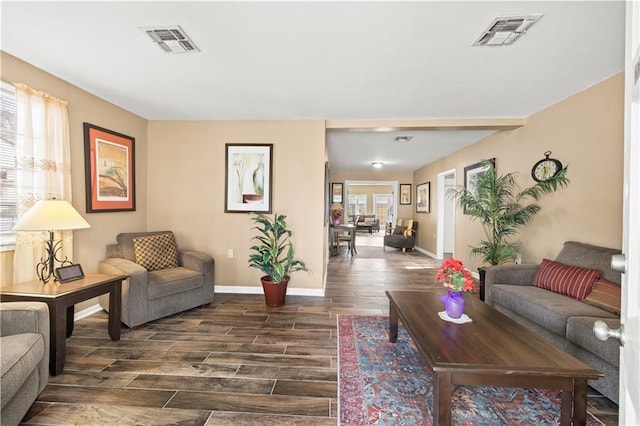 living room with dark hardwood / wood-style flooring