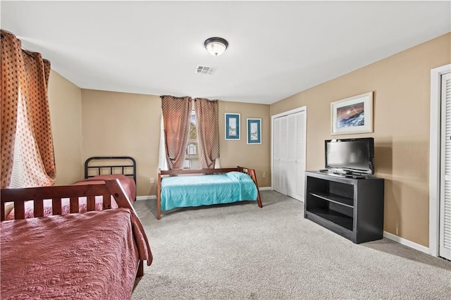 carpeted bedroom featuring a closet