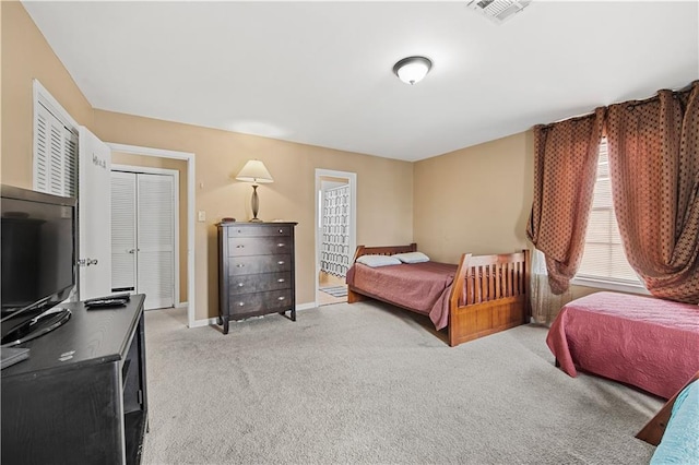 bedroom featuring light colored carpet