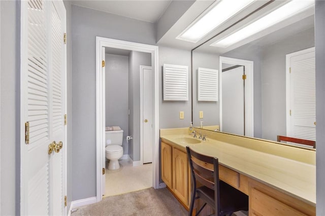 bathroom with vanity and toilet