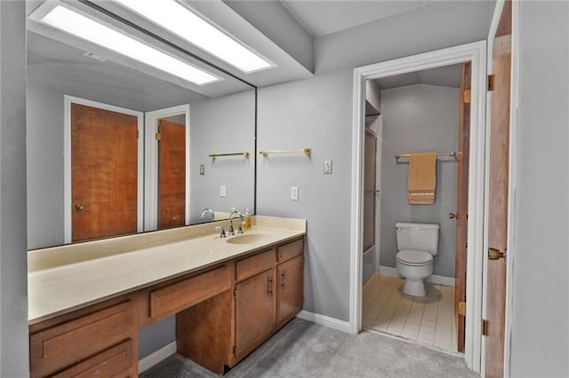 full bathroom featuring toilet, vanity, and shower / bath combination with glass door