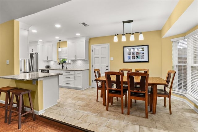 dining space featuring sink