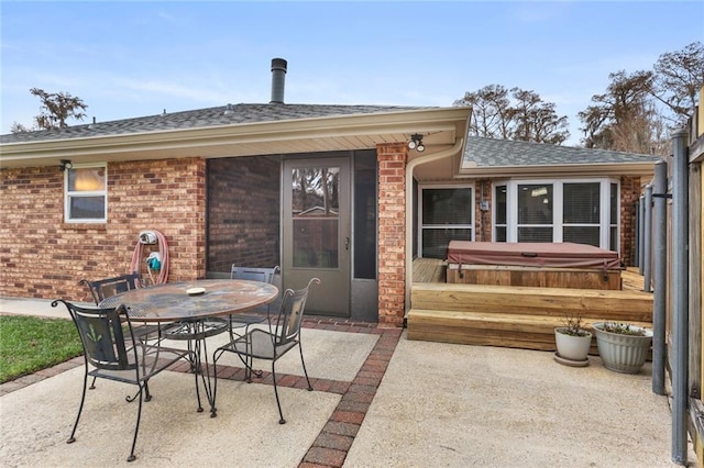 view of patio featuring a covered hot tub