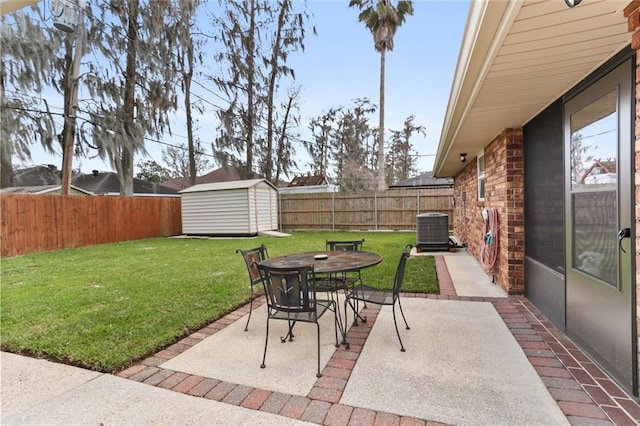 view of patio with cooling unit and a storage unit