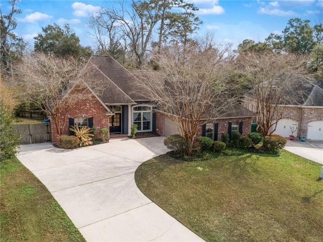 view of front of property featuring a garage and a front yard