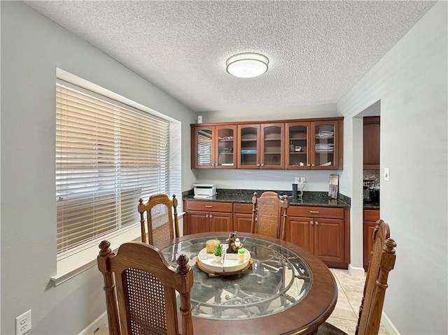 dining room with a textured ceiling