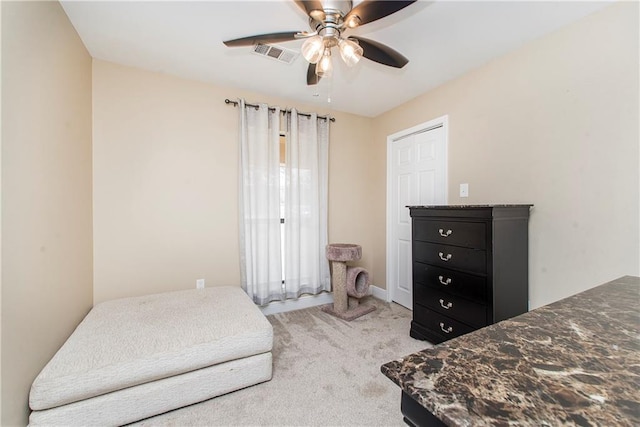 carpeted bedroom featuring ceiling fan