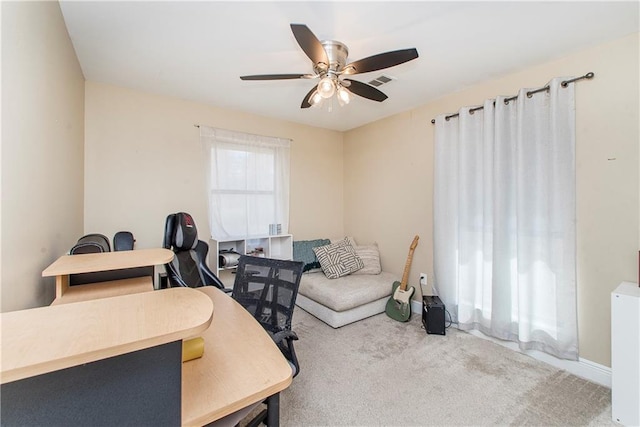 home office featuring ceiling fan and carpet