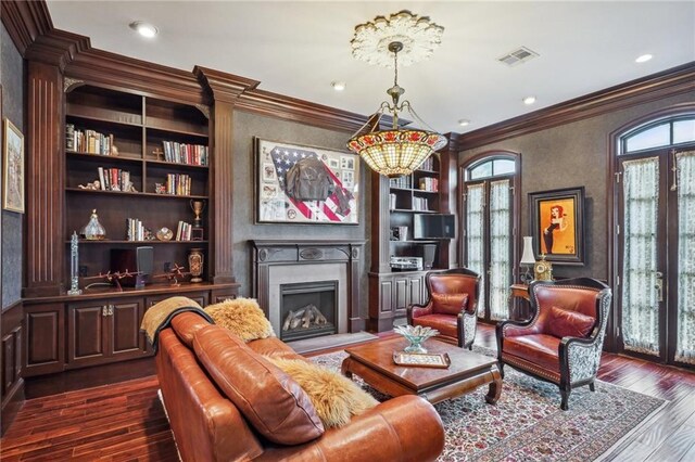 180 E Oakridge Park, Metairie, LA 70005 - sitting room with dark hardwood / wood-style flooring, built in features, ornamental molding, and an inviting chandelier