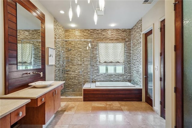 180 E Oakridge Park, Metairie, LA 70005 - bathroom featuring vanity, tile patterned floors, and shower with separate bathtub