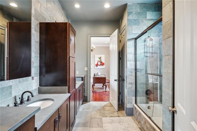 180 E Oakridge Park, Metairie, LA 70005 - bathroom with vanity and shower / bath combination with glass door