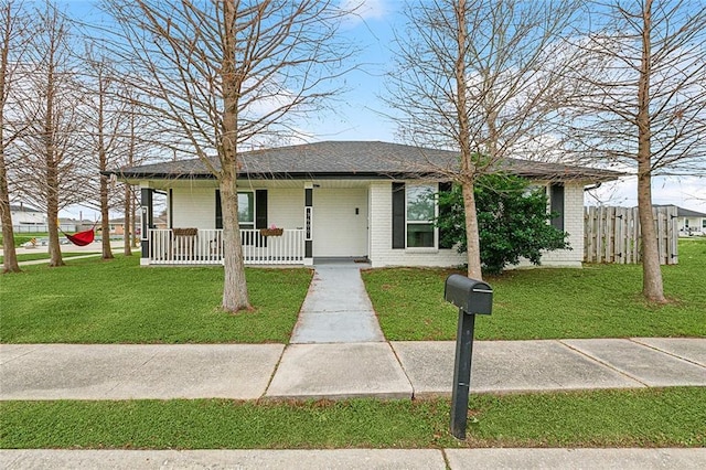 view of front of home with a front lawn and covered porch