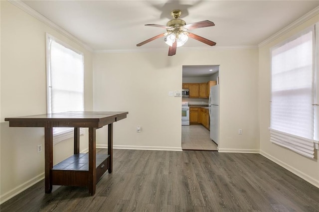 dining space featuring ceiling fan, ornamental molding, and dark hardwood / wood-style floors