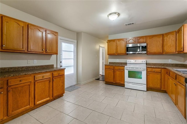 kitchen with appliances with stainless steel finishes and sink