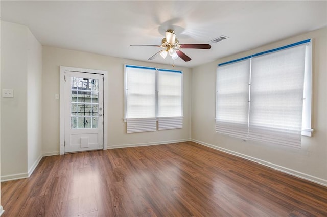 unfurnished room with wood-type flooring and ceiling fan