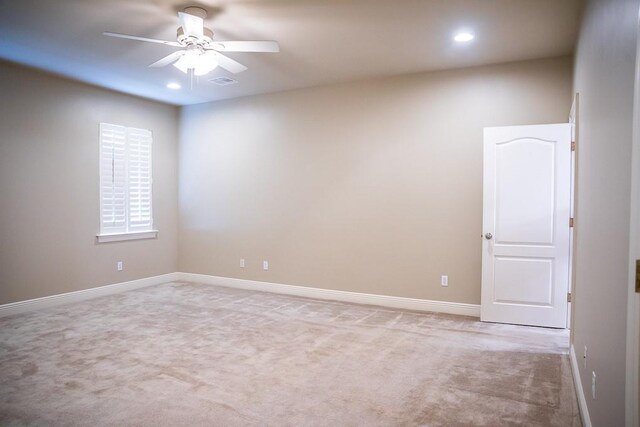 empty room with recessed lighting, a ceiling fan, visible vents, and carpet floors