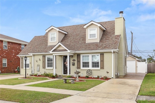 cape cod-style house featuring a front yard