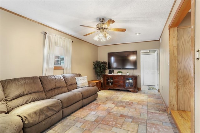 living room featuring crown molding and ceiling fan