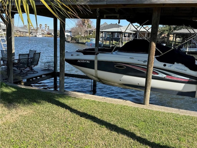 view of dock featuring a water view and a yard