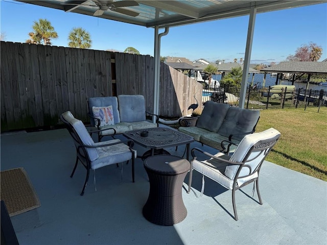 view of patio with an outdoor living space and ceiling fan