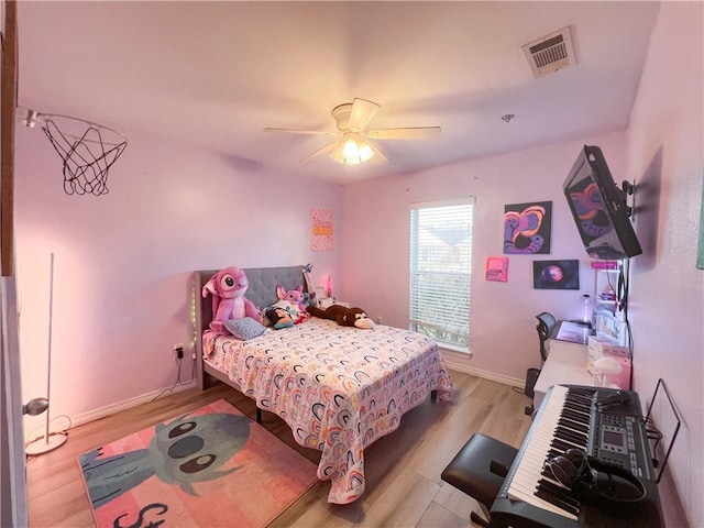 bedroom featuring ceiling fan and light hardwood / wood-style flooring