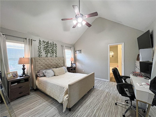 bedroom with high vaulted ceiling, ensuite bath, light hardwood / wood-style floors, and ceiling fan