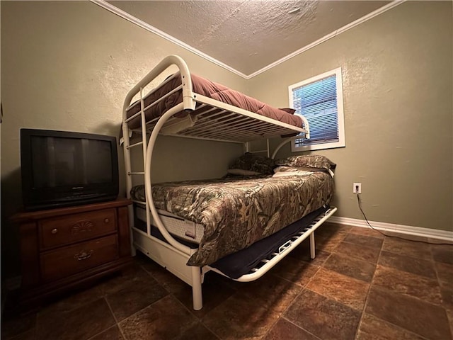 bedroom featuring ornamental molding and a textured ceiling