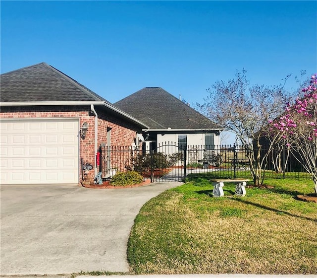 view of front of house with a garage and a front lawn