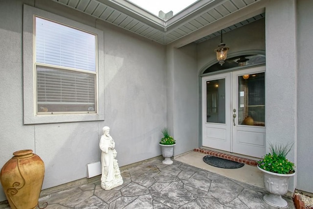 view of exterior entry featuring french doors