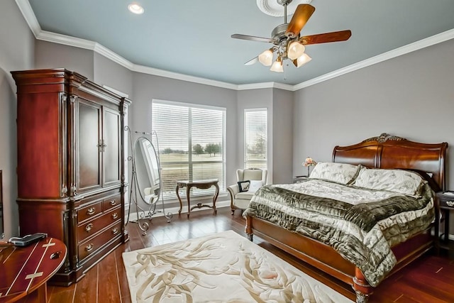 bedroom with dark wood-type flooring, ceiling fan, and crown molding