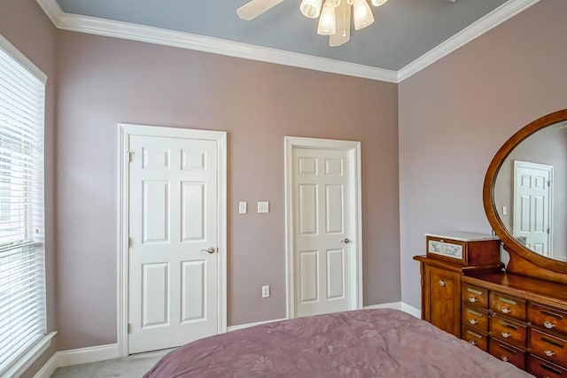 bedroom featuring multiple windows, crown molding, and ceiling fan