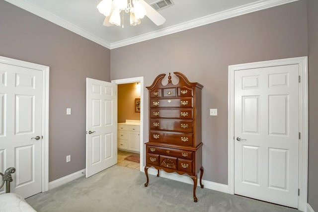 carpeted bedroom with crown molding and ceiling fan