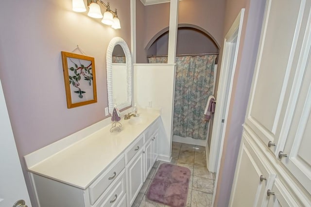 bathroom featuring vanity, curtained shower, and tile patterned floors