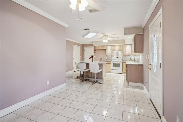 kitchen featuring light tile patterned flooring, visible vents, light countertops, ornamental molding, and white range with electric stovetop