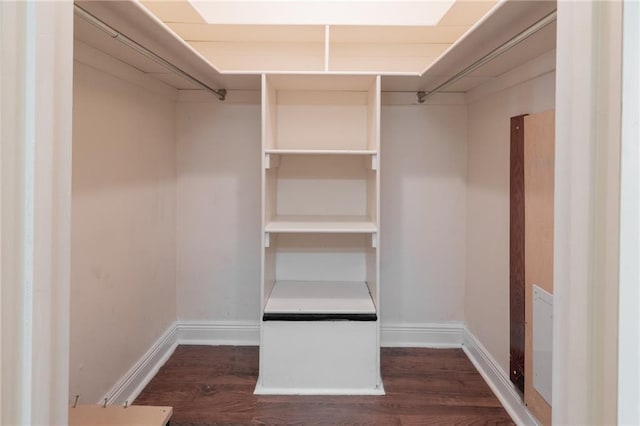 walk in closet featuring dark wood-type flooring