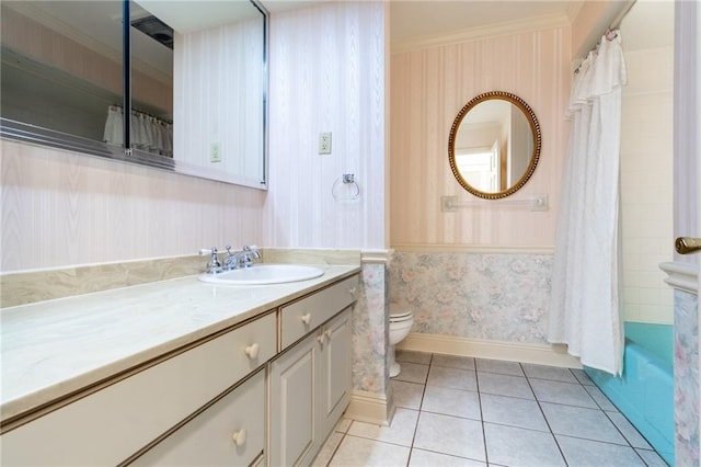 full bathroom featuring tile patterned flooring, shower / tub combo, vanity, ornamental molding, and toilet