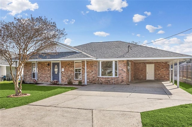 single story home with a front yard and a carport