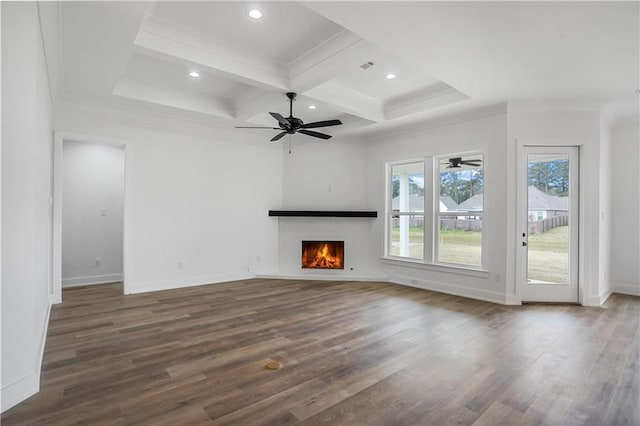 unfurnished living room with ceiling fan, beam ceiling, dark hardwood / wood-style floors, coffered ceiling, and ornamental molding