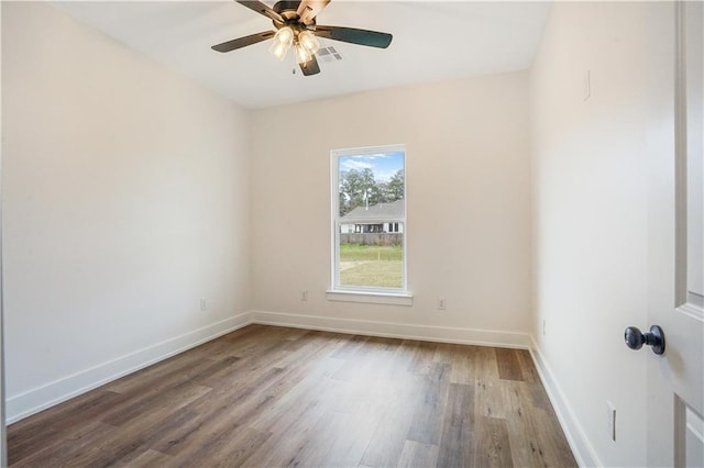 unfurnished room featuring hardwood / wood-style flooring and ceiling fan