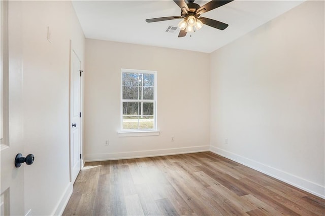 spare room with ceiling fan and light hardwood / wood-style floors