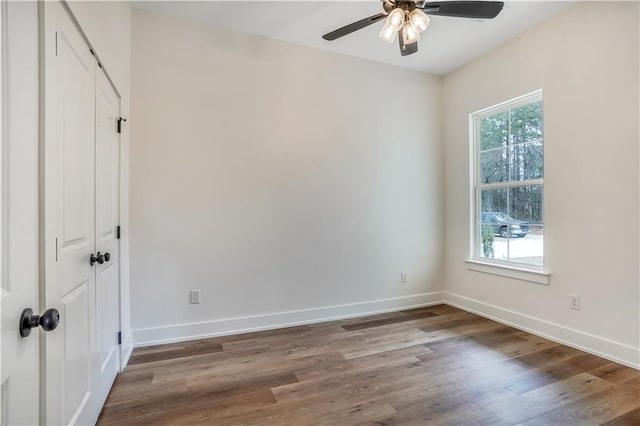 unfurnished room with ceiling fan and wood-type flooring