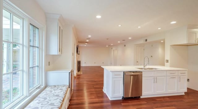 kitchen with dishwasher, sink, white cabinets, and dark hardwood / wood-style flooring