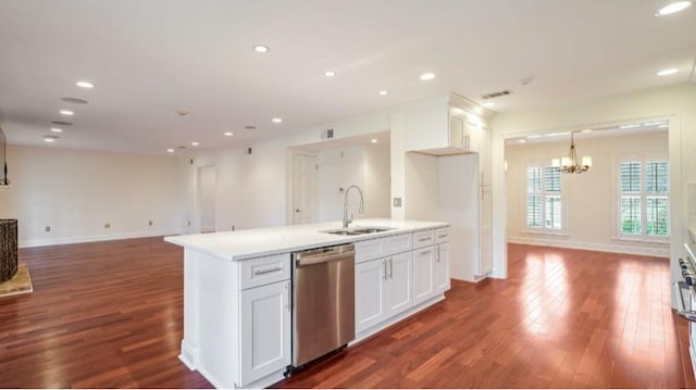 kitchen with white cabinetry, a kitchen island with sink, dishwasher, and sink