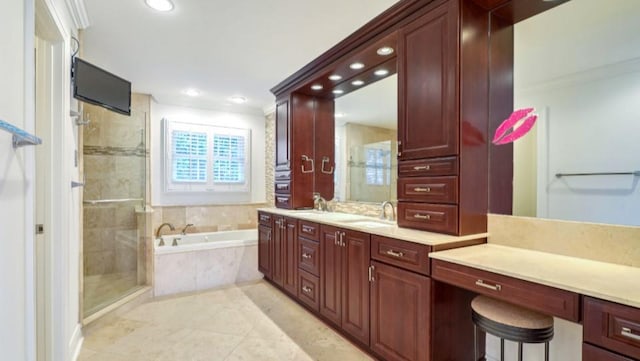 bathroom featuring vanity, tile patterned flooring, crown molding, and shower with separate bathtub