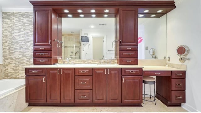 bathroom with ornamental molding, separate shower and tub, and vanity