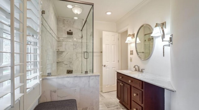 bathroom with vanity, crown molding, and a shower with shower door