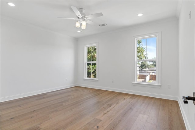 unfurnished room with crown molding, a healthy amount of sunlight, ceiling fan, and light hardwood / wood-style flooring